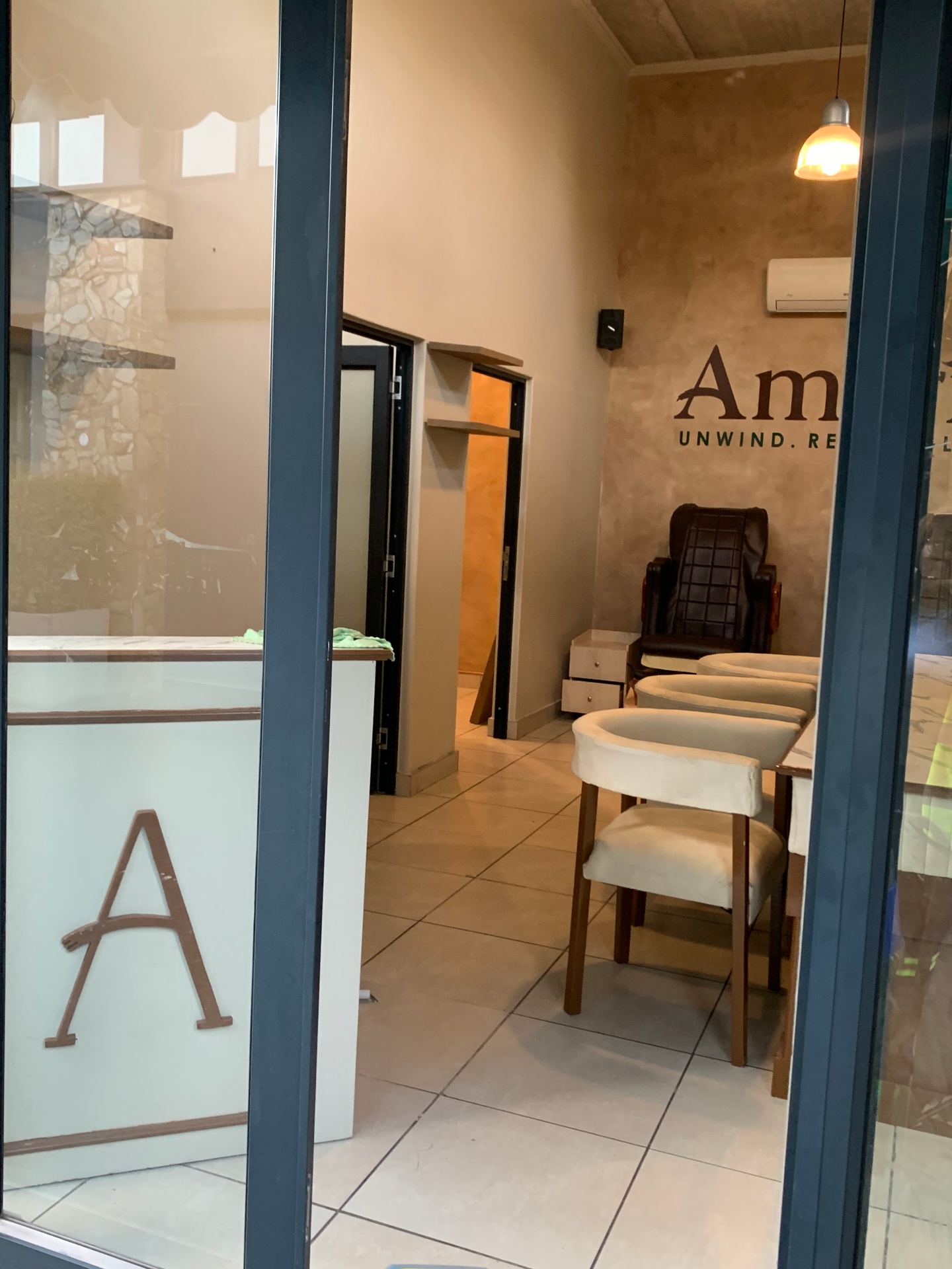 Amaris Spa interior view through storefront with treatment rooms